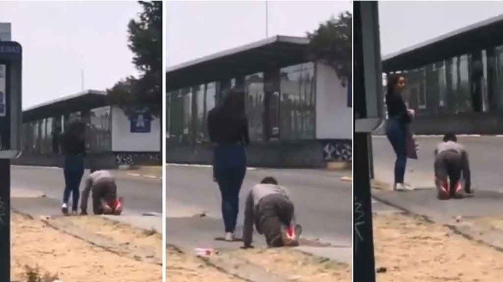 For being unfaithful, a woman makes her boyfriend crawl down the street. photo.video capture